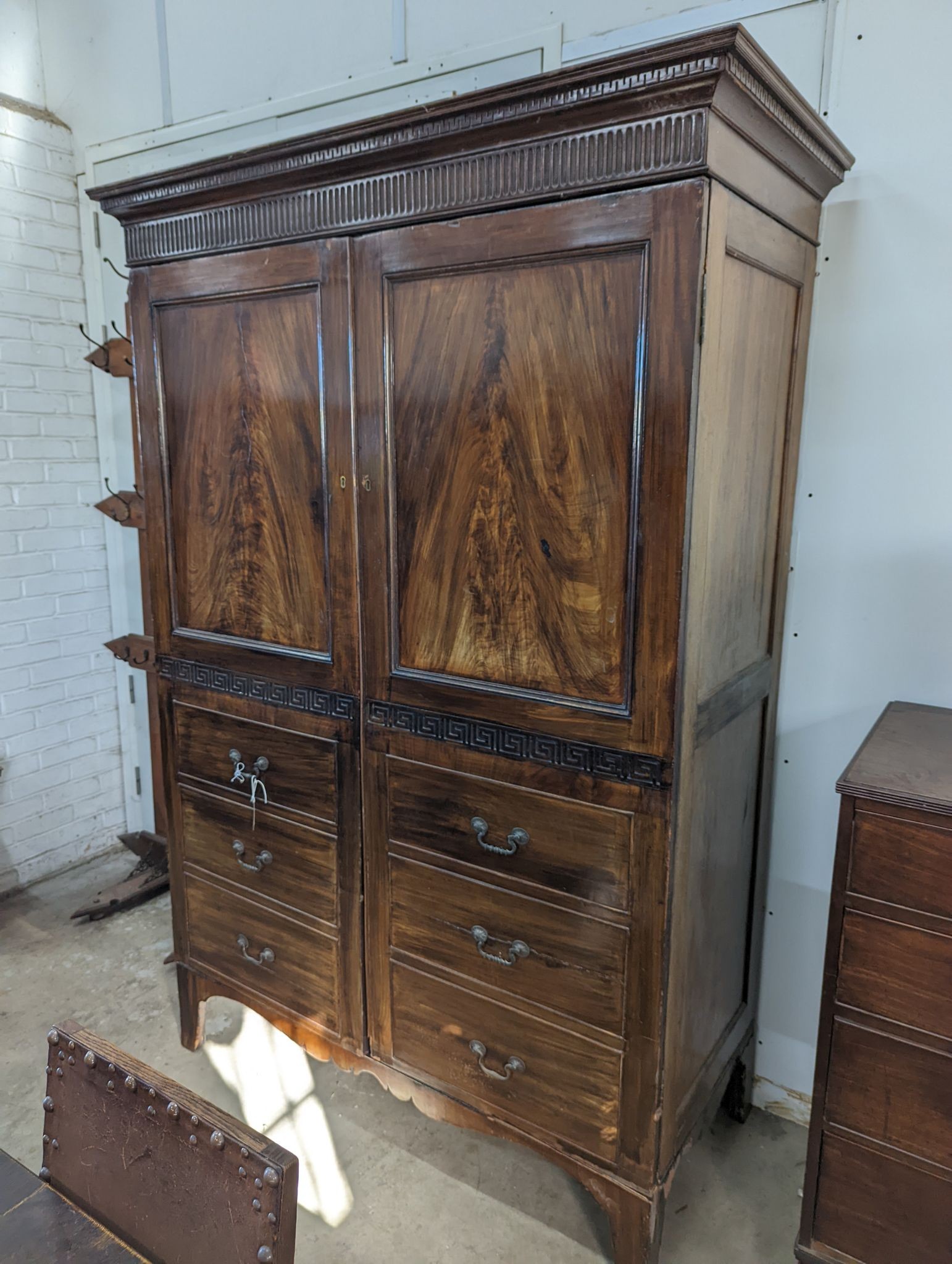 A George IV style mahogany hanging cupboard, width 142cm, depth 65cm, height 209cm